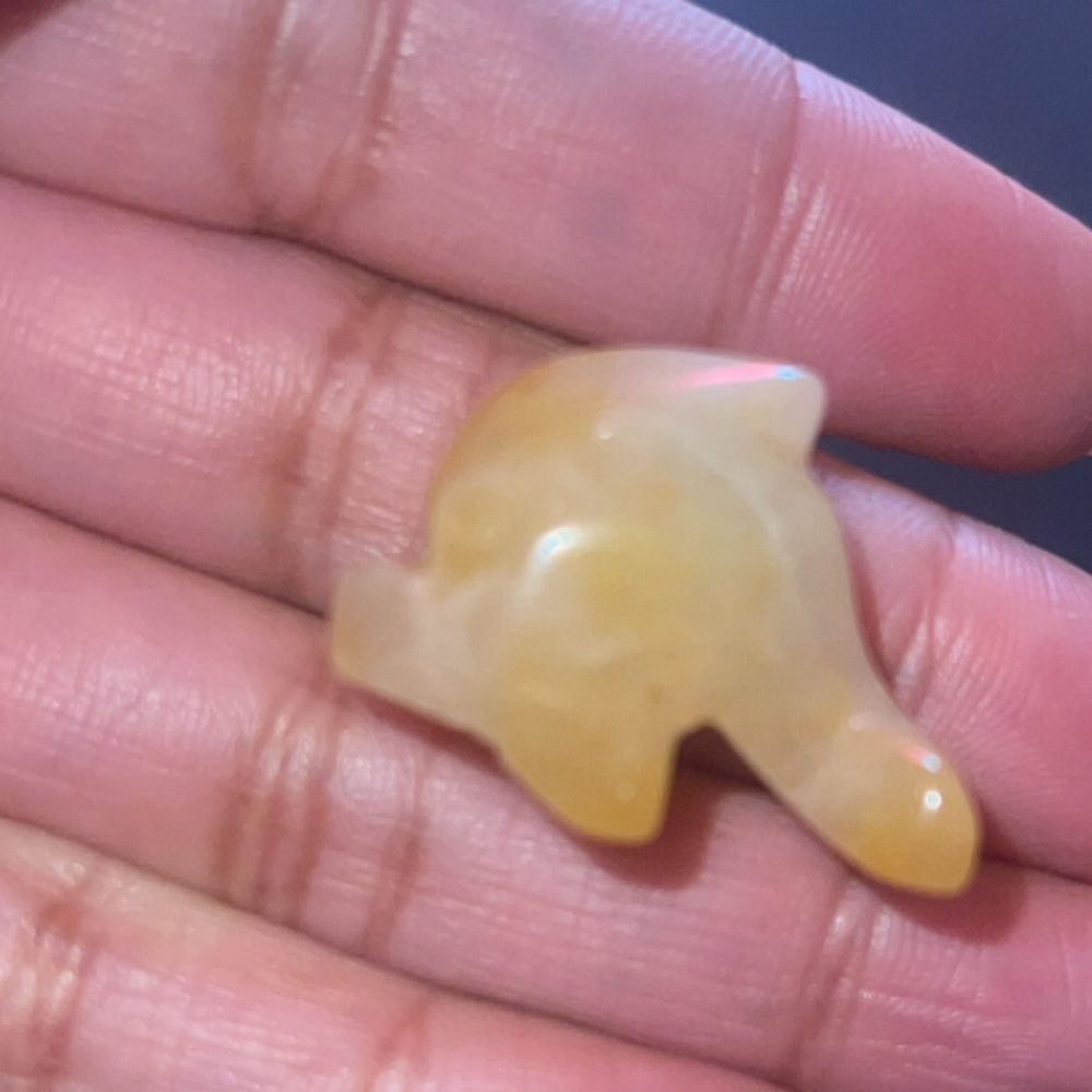 Yellow Dolphin-Shaped Stone